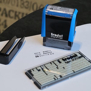 May include: A rustic wooden sign with the text "Welcome to our home" in white lettering. The sign features a distressed finish and a simple, inviting design, perfect for entryway decor.