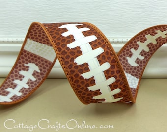 May include: A brown wired ribbon featuring a repeating pattern of a football texture and white laces. The ribbon has a finished stitched edge in a matching brown tone and is displayed in a series of S-shaped curves across the frame.