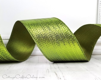 May include: A roll of green metallic ribbon with a textured surface. The ribbon has a subtle shimmer and is perfect for adding a touch of elegance to any craft project.
