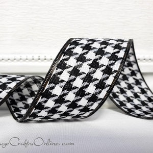 May include: Black and white houndstooth ribbon with a brown edge. The ribbon is woven with a textured pattern.