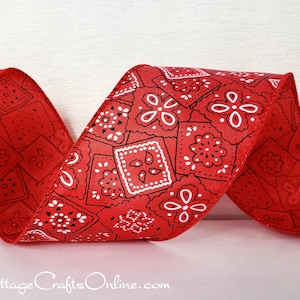 May include: Red and white patterned ribbon with a bandana print. The ribbon is made of satin and has a smooth, silky texture.