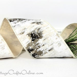 May include: White satin ribbon with a black and white birch bark print. The ribbon is curled and has a white edge.