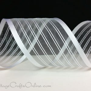 May include: White sheer ribbon with diagonal stripes. The ribbon is rolled and has a slight sheen, with a contrasting white stripe pattern. The background is black and white, highlighting the ribbon's texture and design. The ribbon is suitable for crafts and gift wrapping.