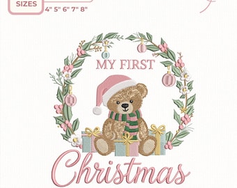May include: An embroidery design featuring a teddy bear wearing a pink Santa hat and scarf, surrounded by a wreath and gifts. Text reads "MY FIRST CHRISTMAS". Available sizes are 4", 5", 6", 7", and 8" in height.