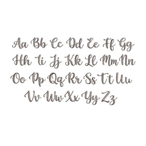 May include: A complete alphabet set featuring both uppercase and lowercase letters from Aa to Zz. Each character is rendered in a dark brown, cursive script font with a subtle shadow effect, arranged in four horizontal rows on a plain background.