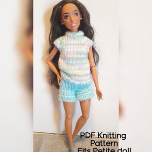 May include: A doll wearing a knitted outfit, including a pastel-colored top and turquoise shorts. The outfit is designed to fit a petite doll. The image includes the text "PDF Knitting Pattern Fits Petite doll."