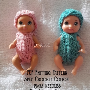 May include: Two baby dolls wearing handmade crochet outfits. One doll is in a pink outfit and matching cap, the other in a teal outfit and cap. The text at the bottom reads "PDF Knitting Pattern, 3ply Crochet Cotton, 2MM Needles, Fits Mattel Baby."