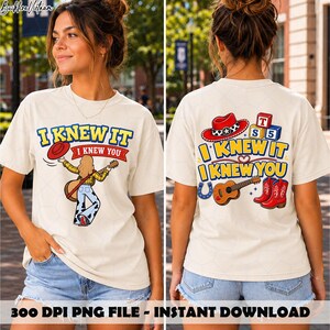 May include: A cream-colored t-shirt featuring a graphic print on the front and back. The front shows a person playing a guitar with the text I KNEW IT I KNEW YOU. The back displays a cowboy hat, alphabet blocks, a guitar, and red boots.