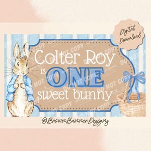 May include: A digital download featuring a watercolor illustration of Peter Rabbit, a blue and white striped background, and a banner that reads "Colter Roy is ONE sweet bunny." A small basket with a blue bow is also included.