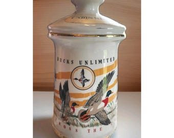 Decantador dorado de Ducks Unlimited Old Cabin Still Wings AcrossContinent, año 1972.