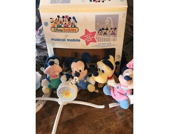 Móvil musical para cuna Dolly Disney Babies, vintage, en funcionamiento, LIMPIO. ¡Es un mundo pequeño!