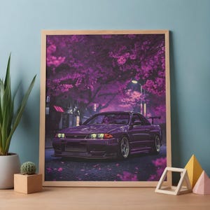 May include: A framed print of a purple sports car driving on a road lined with purple flowering trees. The car has a spoiler and silver rims. The image has a soft, dreamy quality.