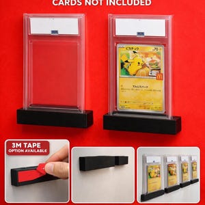 May include: Clear acrylic PSA graded card wall mounts with black bases. The text "PSA GRADED CARD WALL MOUNT" and "CARDS NOT INCLUDED" are displayed. The image shows the mounts with and without cards, and the text "3M TAPE OPTION AVAILABLE", "EASY TO INSTALL", and "PERFECT FOR DISPLAY".