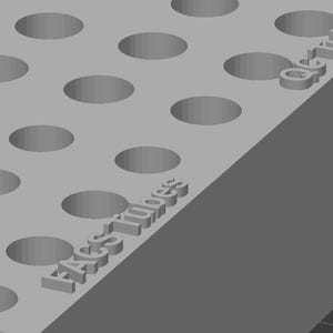 Peut inclure: Un plateau rectangulaire gris avec des trous circulaires espacés uniformément. Le texte "EASY Tubes" est en relief sur le côté. Le design est simple et géométrique, suggérant un produit d'organisation ou de stockage.