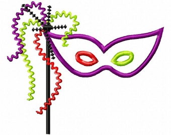 May include: A purple masquerade mask with green and red accents attached to a stick with colorful curly streamers.