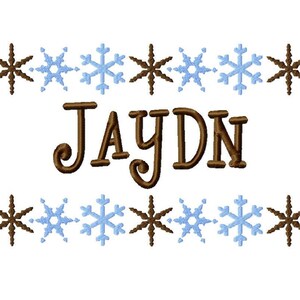 May include: Brown embroidered name "JAYDN" with a border of alternating brown and blue snowflakes.