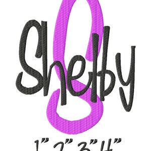 May include: Embroidered design of the name "Shelby" in black with a large purple letter "S" in the center. The design includes size options: 1", 2", 3", and 4".