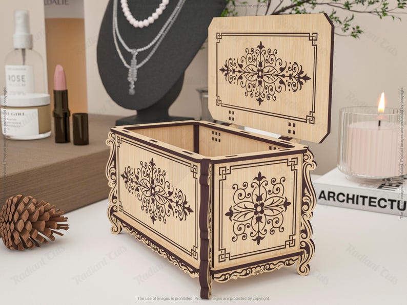 May include: A wooden jewelry box with an open lid, featuring intricate floral and geometric designs in dark brown against a light wood background. The box has a rectangular shape with curved edges and is displayed on a white surface.