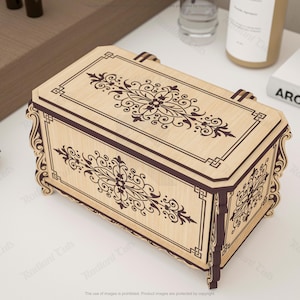 May include: A decorative wooden box with a light brown finish and dark brown accents. The box features intricate floral and geometric patterns on the lid and sides. The box has a rectangular shape with curved edges and a handle.