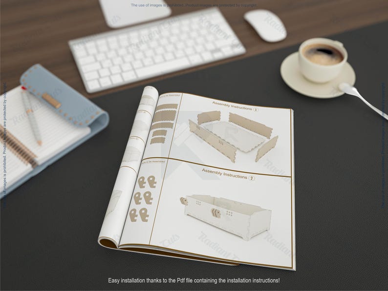 May include: Open instruction manual with assembly diagrams for a wooden product. The manual is on a dark surface, next to a keyboard, mouse, and a cup of coffee. The text reads "Assembly Instructions" and "Easy installation thanks to the Pdf file".