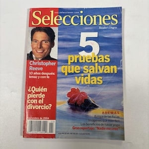 May include: A magazine cover with the title "Selecciones" and the Reader's Digest logo. The cover features a portrait of Christopher Reeve, and the headline "5 pruebas que salvan vidas." Additional text includes "¿Quién pierde con el divorcio?" and "Noviembre de 2004."