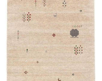 May include: Beige rectangular rug with a repeating pattern of small, colorful geometric shapes and stylized trees and deer. The rug has a neutral color palette with accents of red, green, and gray, creating a subtle, yet decorative design.