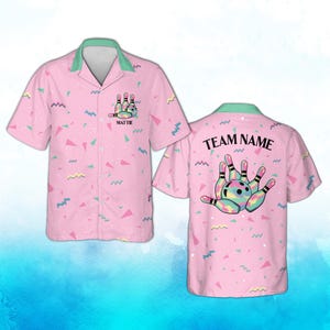 May include: Pink bowling shirt with a bowling pin and ball graphic. The shirt has a green collar and a pattern of colorful shapes. The front of the shirt says "Mattie" and the back says "Team Name".