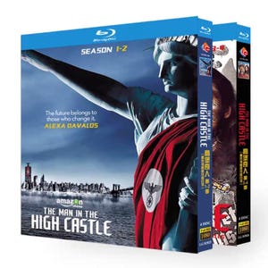 May include: Blu-ray box set of "The Man in the High Castle" seasons 1-2. The cover shows the Statue of Liberty in a red and white cloak, with the title and Amazon logo. Includes the text "The future belongs to those who change it. ALEXA DAVALOS."