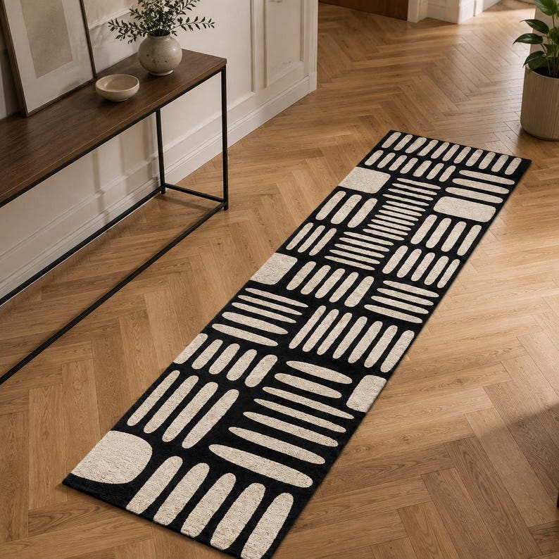 Hand tufted black & ivory geometric runner rug on herringbone oak floor, modern hallway runner carpet for entryway, luxury minimalist home decor