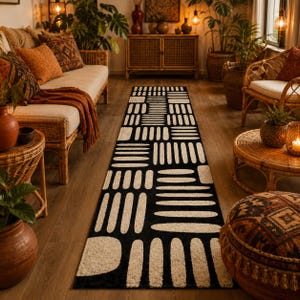 Black & ivory geometric runner rug in a warm boho living room, hand tufted wool hallway carpet with modern abstract design and earthy home decor