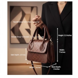 May include: A brown handbag with a snakeskin pattern. The bag has a handle drop of 11.4 cm, a height of 14 cm, a width of 17.8 cm, a side depth of 6.4 cm, and a base depth of 7.6 cm.