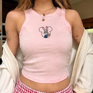 May include: A set of three ceramic mugs with a speckled, matte finish in cream, light grey, and dark grey. Each mug has a simple, minimalist design, suitable for coffee or tea.