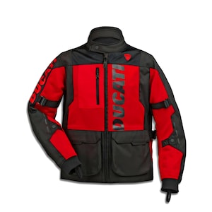 May include: A red and black Ducati motorcycle jacket. The jacket features the word "DUCATI" printed vertically on the front and on the left sleeve. It has a stand-up collar, multiple pockets, and adjustable straps.