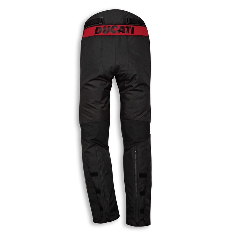 May include: Black motorcycle pants with a red waistband featuring the word "DUCATI" in red lettering. The pants have zippers at the ankles and reinforced knee areas. The pants are designed for motorcycle riding.