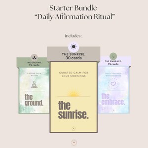 May include: A starter bundle of affirmation cards, including "The Sunrise" with 30 cards, "The Ground" with 15 cards, and "The Embrace" with 15 cards. Each card set features a unique design and theme, with text such as "Finding Calm Within".
