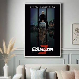 May include: A framed movie poster for "The Equalizer 3" featuring Denzel Washington. The poster has a black background with a reflective image of the actor. The title is in white and red, with the actor's name at the top.