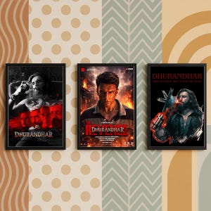 May include: Three framed movie posters with black frames. The posters feature the movie title "Dhurandhar" and images of actors. The background has a mix of patterned wallpaper in beige, white, and green.