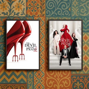 May include: Two framed movie posters. The left poster features red high heels with trident heels and the text "THE DEVIL WEARS PRADA 2". The right poster shows a group of people in formal attire, with the same movie title.