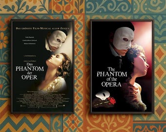 May include: Two framed posters of "The Phantom of the Opera" musical. One poster is in German, featuring the text "Das Phantom der Oper." The other poster is in English, with the title "The Phantom of the Opera." Both posters feature images of the masked Phantom and a woman.