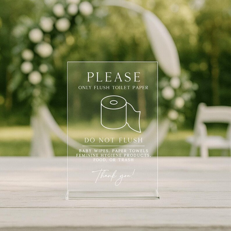May include: Clear acrylic sign with the text "PLEASE ONLY FLUSH TOILET PAPER" and a toilet paper roll graphic. Below, it reads "DO NOT FLUSH" followed by a list of items. The sign ends with "Thank you!" in script font.