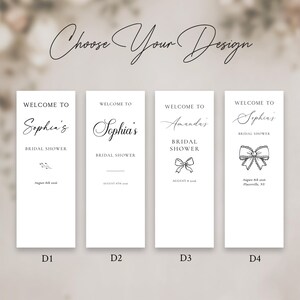 May include: Four white rectangular signs with elegant calligraphy. Each sign reads "Welcome to" followed by a name, "Bridal Shower," and a date. The top text says "Choose Your Design."