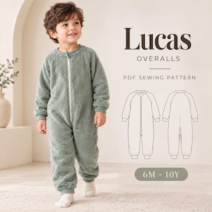 May include: A sage green long-sleeve fleece jumpsuit with a front zipper closure. The text reads Lucas OVERALLS PDF SEWING PATTERN 6M - 10Y. A line drawing shows the front and back views of the garment with cuffed sleeves and ankles.