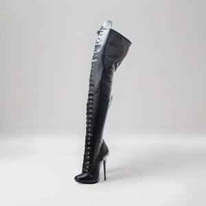 “Classic lace-up round toe knee boots with high 14cm stiletto heel for fashion styling.”