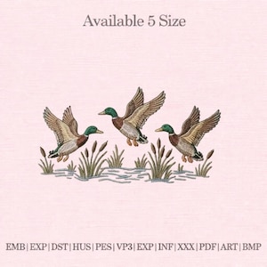 May include: An embroidered design featuring three ducks in flight over reeds and water. The ducks have brown and white feathers, green heads, and are set against a light pink background. The text "Available 5 Size" is at the top.