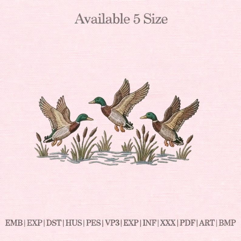 May include: An embroidered design featuring three ducks in flight over reeds and water. The ducks have brown and white feathers, green heads, and are set against a light pink background. The text "Available 5 Size" is at the top.