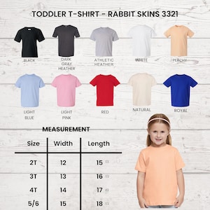 May include: A variety of toddler t-shirts in different colors, including black, gray, white, and blue. The image also shows a measurement chart with sizes ranging from 2T to 5/6, with widths from 12 to 15 inches and lengths from 15.5 to 18.5 inches.
