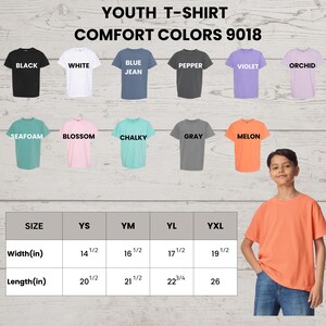 May include: Image showcasing a youth t-shirt in various colors, including black, white, blue jean, pepper, violet, orchid, seafoam, blossom, chalky, gray, and melon. The image also displays size measurements in inches for widths and lengths.