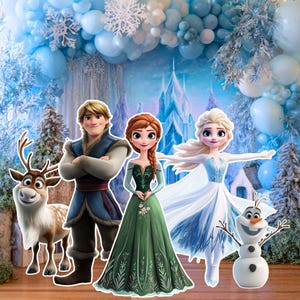 May include: A colorful image featuring characters from the animated movie "Frozen." The characters include Anna, Elsa, Kristoff, Olaf, and Sven, set against a backdrop of a winter scene with a castle and balloons.