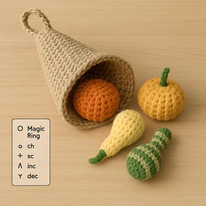 May include: A crocheted cornucopia overflowing with an orange crocheted ball. Additional crocheted items include a yellow pumpkin, a yellow squash, and a green and white striped gourd. A wooden sign displays crochet instructions.