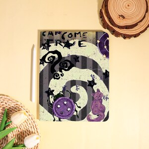 May include: A tablet case with a whimsical design featuring a spiral pattern in gray and white stripes. The case has a purple cat, a purple beetle, and black stars. The text "CAN COME TRUE" is at the top.